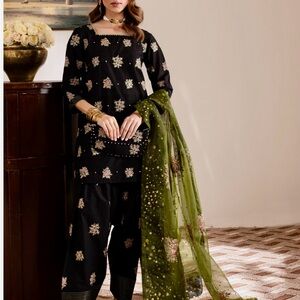 Elegant Black and Green Farshi shalwar style Eid dress.